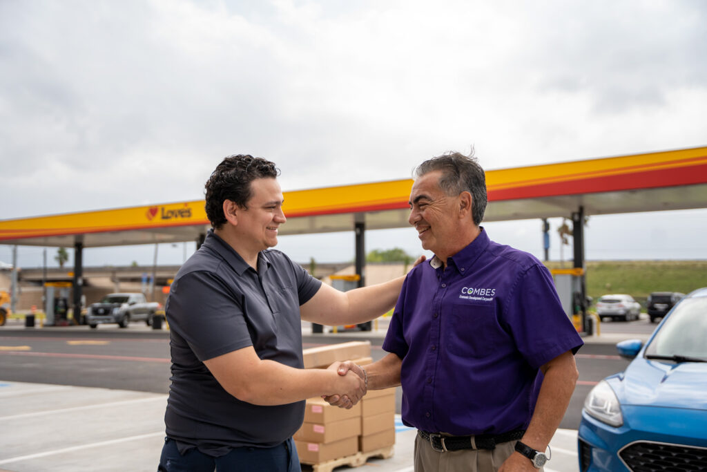 mayor marco sanchez shakes hands with love's travel stop manager day before grand opening in combes texas